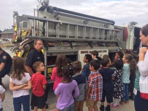 Students learning about a firetruck.