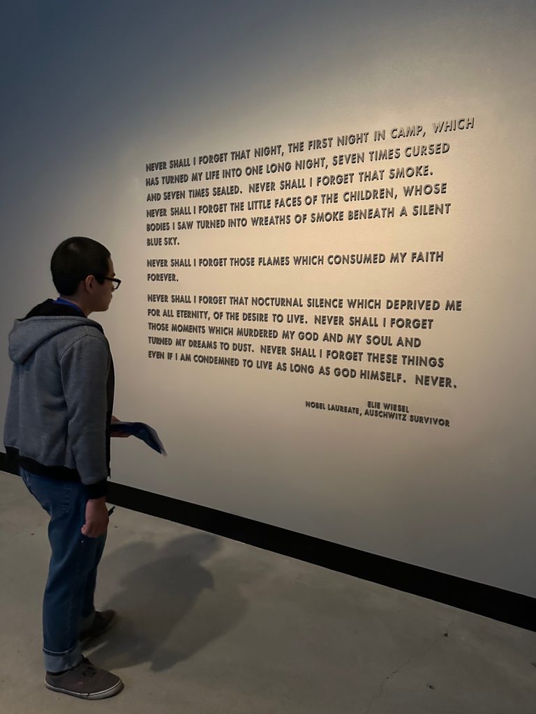 A student looking at a quote displayed in the museum
