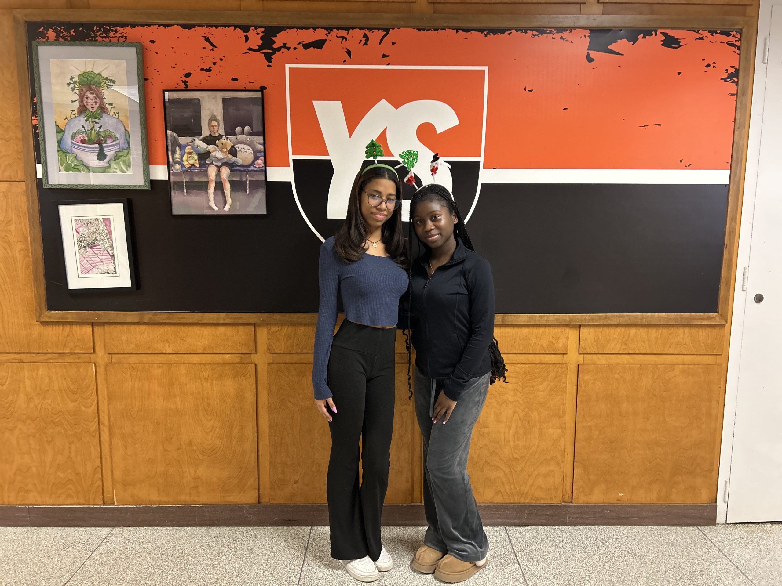 Angelina (left) and Kateshia (right) wearing festive headbands for a school spirit day