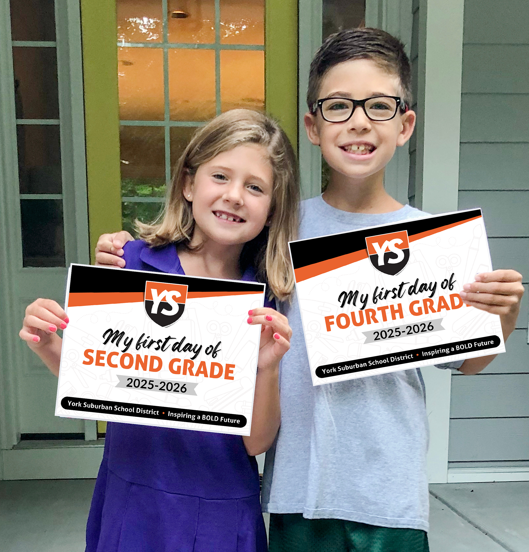 students holding first day signs